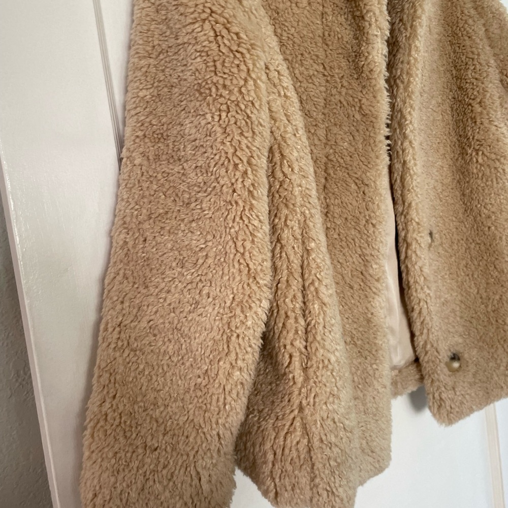 faux fur jacket. Slightly oversized through the sleeves, collar, and body.